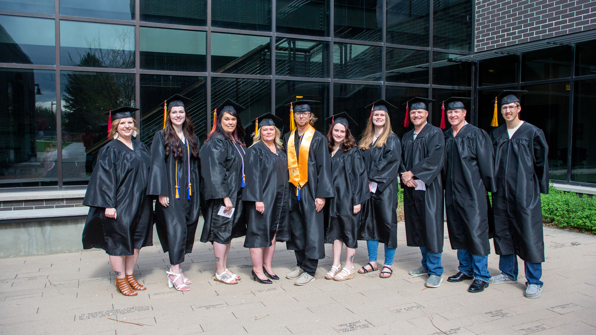 Class of 2023 B.A.S. graduates outside Yellowstone Building