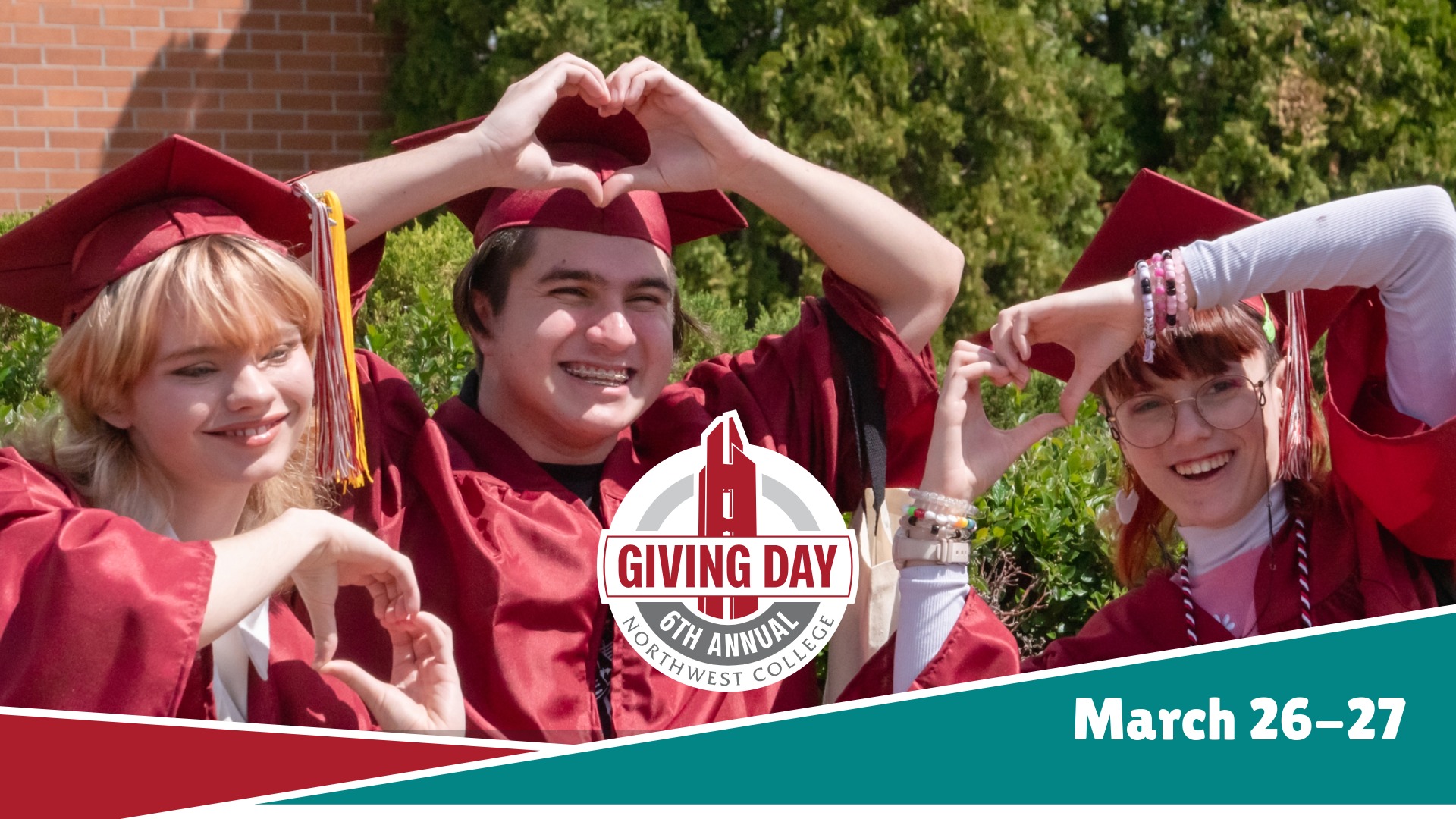 Three students in cap and gown each holding their hands in the shape of heart with a Giving Day logo at the bottom