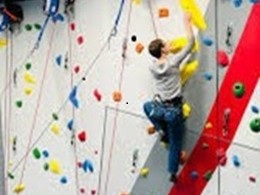 students using rock wall